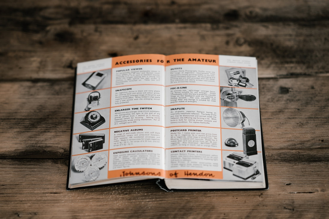 opened book laid in brown table