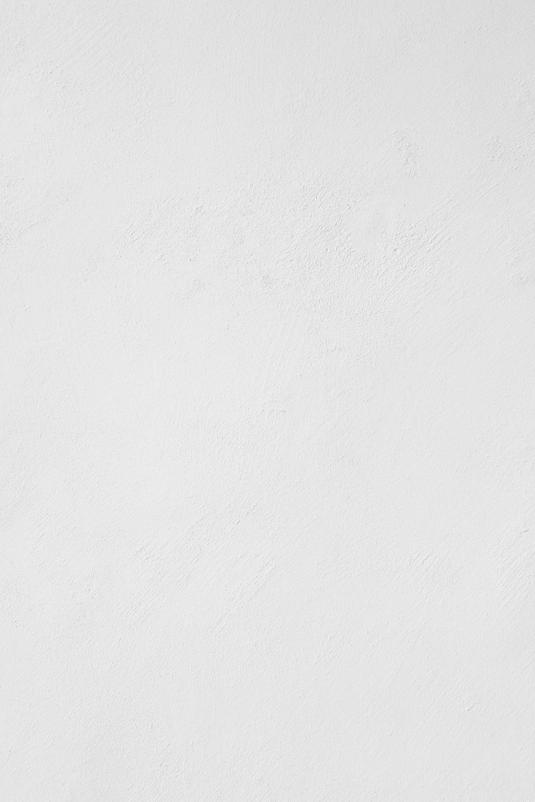 a man riding a snowboard down a snow covered slope