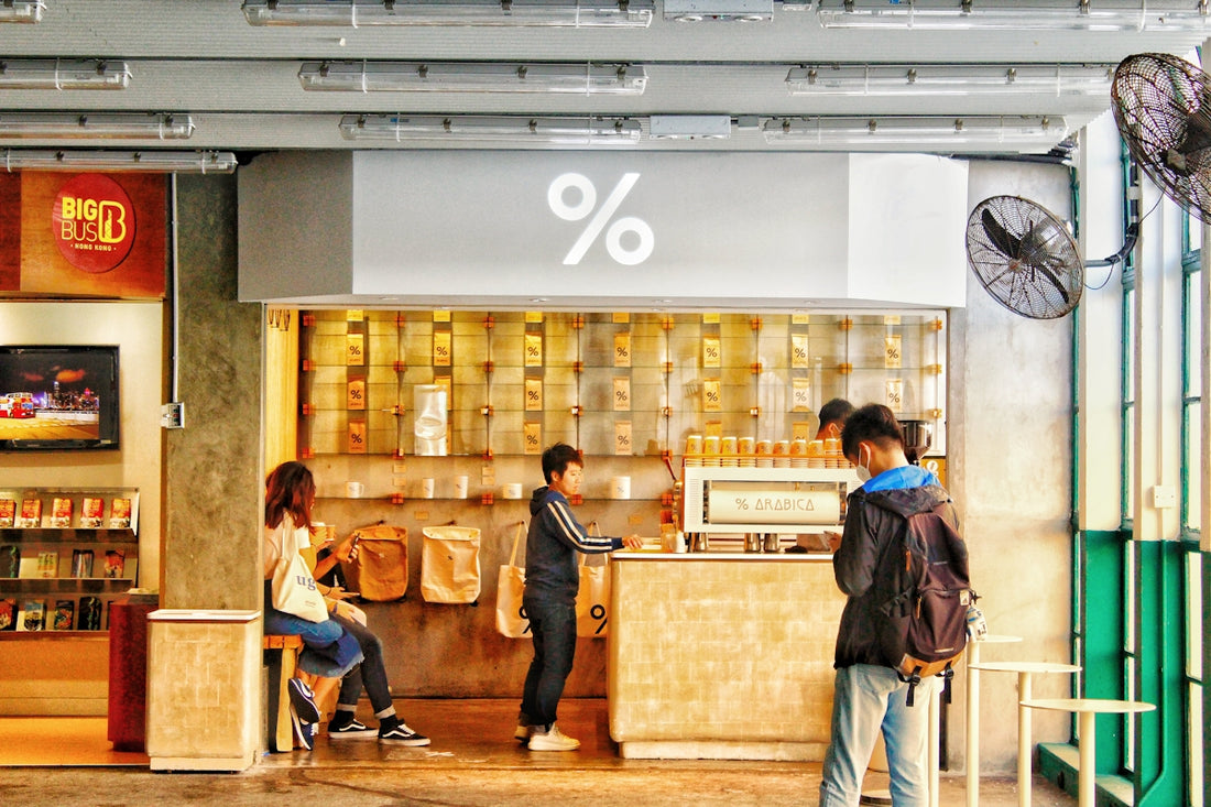 people standing in front of brown wooden table