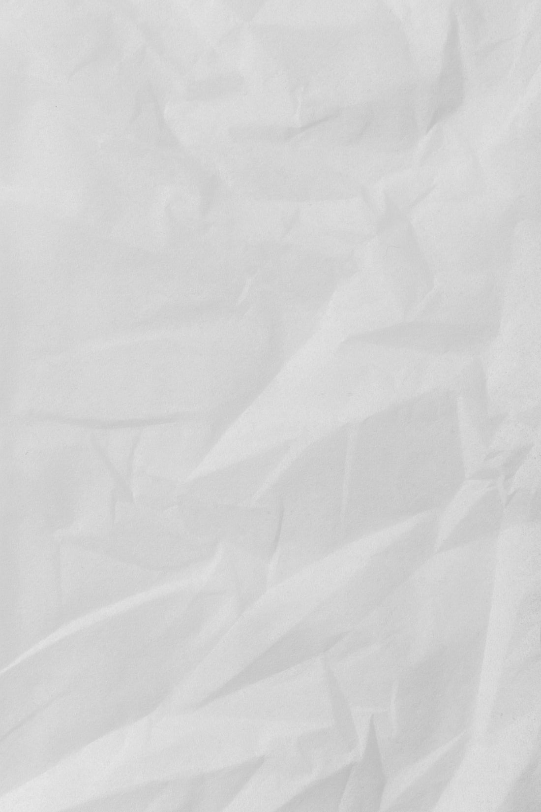 white textile on brown wooden table