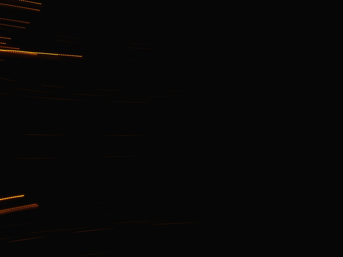 Streaks of light against a dark background