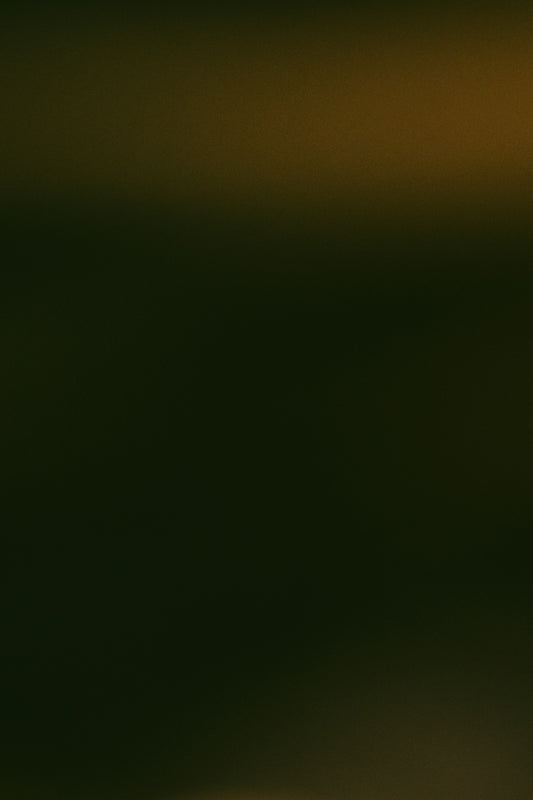 Dark abstract background with subtle warm light.